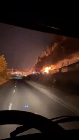 Smoke and fire rise from an industrial facility, which, according to the governor of the southern Russian region, was damaged in a Ukrainian drone attack, in Saratov, Russia, in this screengrab obtained from social media video